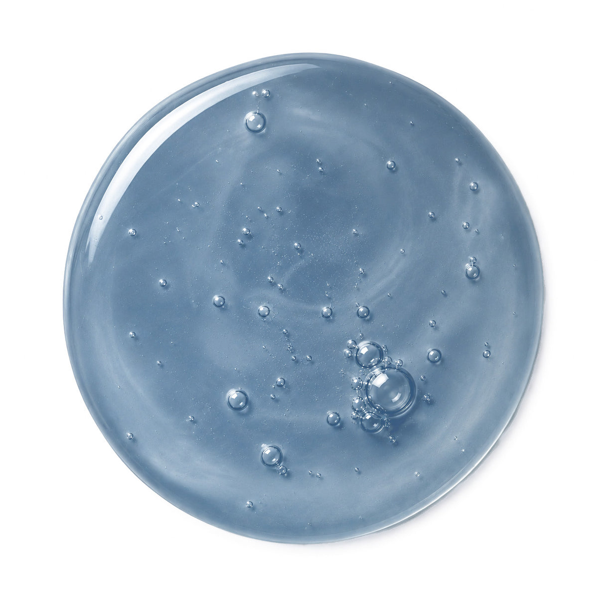 A circular swatch of translucent light blue gel or slime with visible air bubbles, photographed on a plain white background.