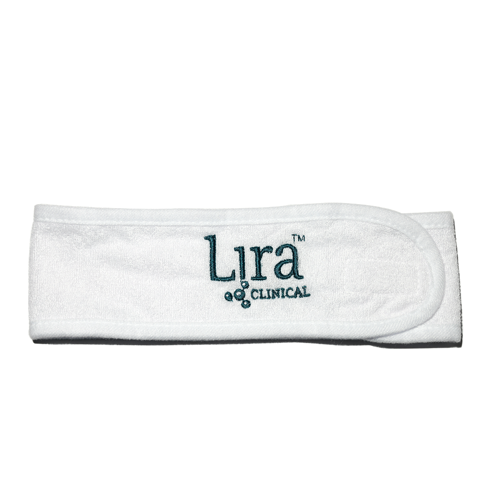 White head band with green writing and atom